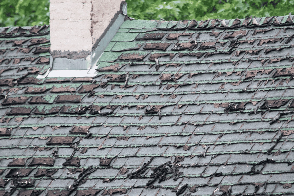 Before — damaged curling shingles
